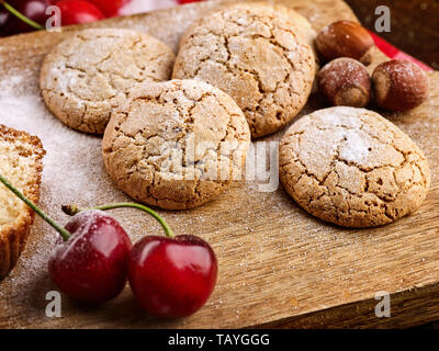 Oatmeal cookies snack and cherry breakfast close up Stock Photo