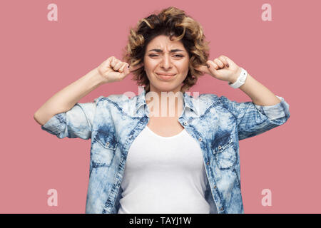 Hispanic woman with bang hairstyle standing over isolated background ...