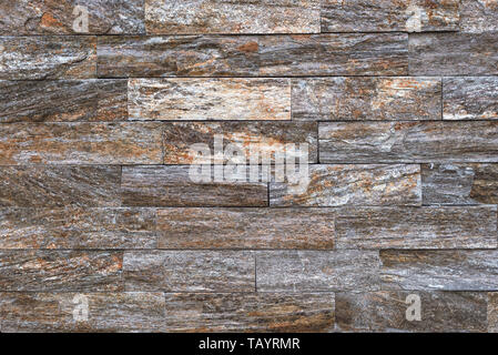 Stone brick tile as background, modern italian style wall made of tiled stone blocks Stock Photo