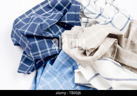 Pile of linen kitchen towels on  white background with place for text, top view Stock Photo