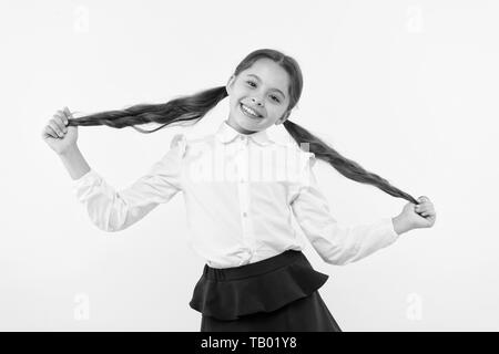 Education online. small girl child. private teaching. happy little girl in school uniform. Back to school. Childhood happiness. Smart school girl. childrens day. I have finally graduated. Stock Photo