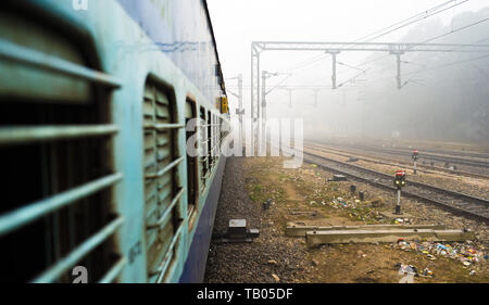 View through the window train in the polluted city of New Delhi, India. Stock Photo