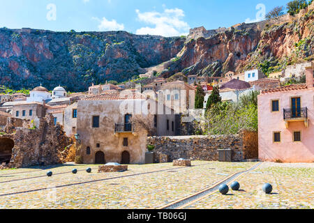 Monemvasia sea and street panorama with old houses, trees in ancient town, Peloponnese, Greece Stock Photo