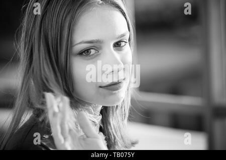 Beautiful European teenage girl, black and white close up outdoor portrait Stock Photo