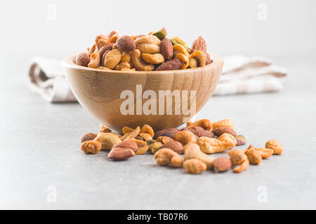 Spicy flavoured nuts. Mix of nuts in bowl. Stock Photo
