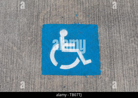 Disabled parking sign painted on tarmac Stock Photo