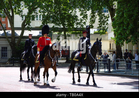 Horsemen and palace guard in front of the Buckingham palace. Queen's birthday celebration rehearsal 2019. London, UK. Stock Photo