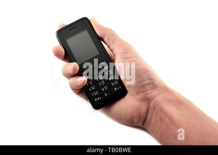 Telephone in hand / Old model mobile phone isolated on white background Stock Photo