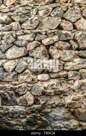 Background from the ancient rough stone on the medieval facade of the monastery of Khor Virap in Armenia Stock Photo