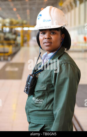 Johannesburg, South Africa - April 12 2012: Female Technician in turbine room at Coal Burning Power Station Stock Photo