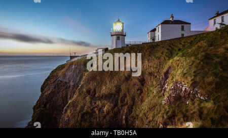 Dawn at Blackhead Lighthouse, County Antrim, Northern Ireland. Stock Photo