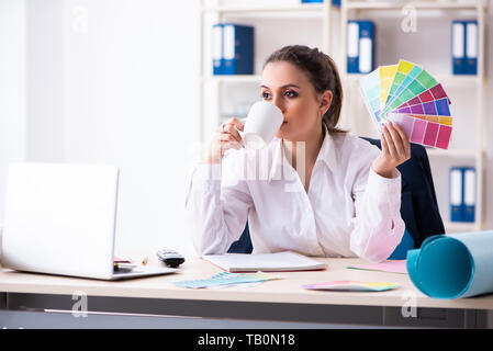 Female beautiful designer working in the office Stock Photo