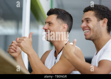 happy men in the gym Stock Photo