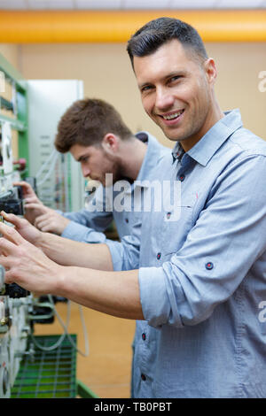 engineers testing a panel Stock Photo