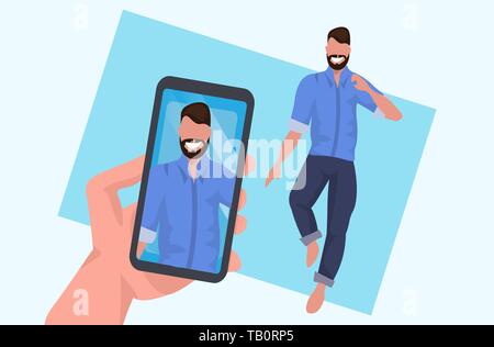 hand holding smartphone and taking photo on camera casual man standing pose male cartoon character posing flat full length horizontal Stock Vector