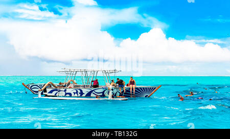BORA BORA, FRENCH POLYNESIA - SEPTEMBER 19, 2018: Group of tourists in the boat Stock Photo