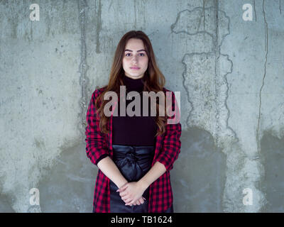 portrait of young female architect on construction site while checking documents and business workflow in new startup office Stock Photo