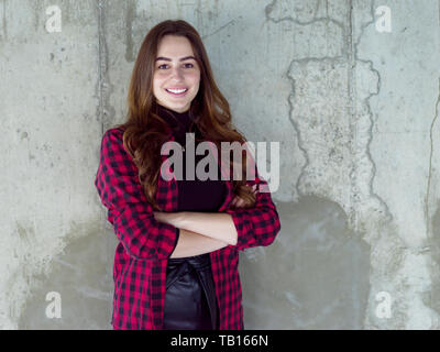 portrait of young female architect on construction site while checking documents and business workflow in new startup office Stock Photo