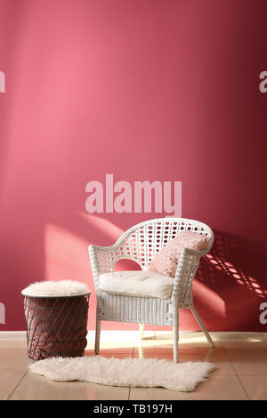 Soft Armchair With Table Near Color Wall In Living Room Stock Photo Alamy