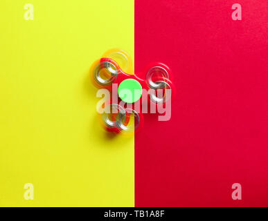 Stroboscopic photo of moving spinner on color background Stock Photo
