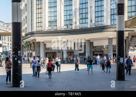 People walking by the main entrance of Bruxelles Central train station across the Carrefour de l'Europe redesigned in 2010 with a rotunda. Stock Photo