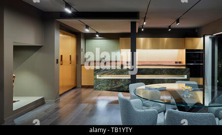 Kitchen and dining area. Elizabeth Bay Apartment, Elizabeth Bay, Australia. Architect: Rolf Ockert Architect, 2019. Stock Photo