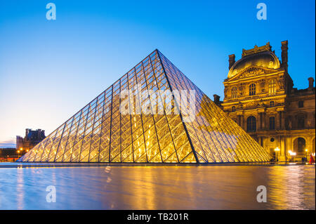 Paris, France - June 18, 2015: night scene of The Louvre Palace and the pyramid in Paris Stock Photo