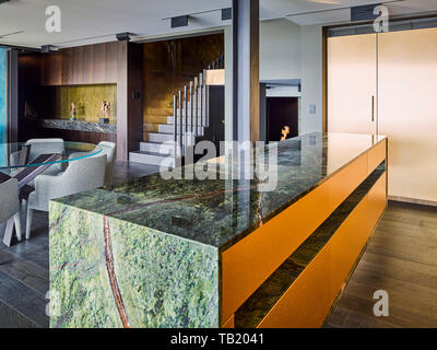 Kitchen and dining areas. Elizabeth Bay Apartment, Elizabeth Bay, Australia. Architect: Rolf Ockert Architect, 2019. Stock Photo