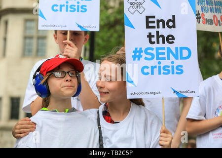 London, UK. 30th May, 2019. Hundreds of parents, carers, pupils and young people with disabilities protest in Westminster to highlight a funding crisis in Special Education Needs and Disabilities (SEND). SEND National Crisis, a campaign group deliver a petition to Downing Street before joining the protest. 25 other locations around the country stage similar events. Credit: Imageplotter/Alamy Live News Stock Photo