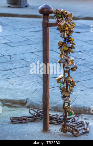 Padlocks on a pole in the street Stock Photo