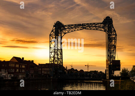 Willebroek, Belgium - May 27, 2019:  The iron drawbridge over the Brussels-Scheldt canal in Willebroek by sunset Stock Photo