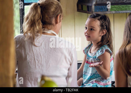 Girl talking with her grandmother Stock Photo