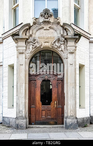 Schöneberg-Berlin. Decorative entrance with columns & sculptural details on Historic listed building on Viktoria Luise Platz Stock Photo