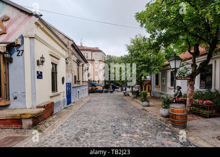 Belgrade, Serbia - June 16, 2018. Historic place Skadarlija with shops, galleries, cafes, trees, cobbled lanes and alleys in downtown. Bohemian street Stock Photo