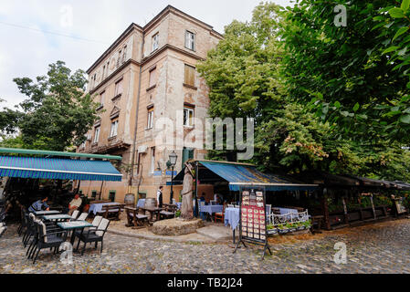 Belgrade, Serbia - June 16, 2018. Historic place Skadarlija with summer cafe terraces, trees, cobbled lanes and alleys in downtown. Bohemian street wi Stock Photo