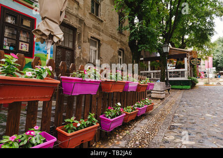 Belgrade, Serbia - June 16, 2018. Flowers in pots on historic place Skadarlija with trees, cafes, cobbled lanes and alleys in downtown. Bohemian stree Stock Photo