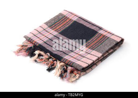 Folded plaid cloth with tassels isolated on white Stock Photo