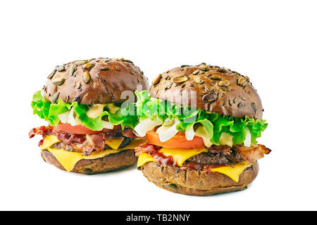 Two hamburgers with cereal buns on white background Stock Photo