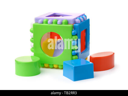 Plastic shape sorter cube and blocks isolated on white Stock Photo