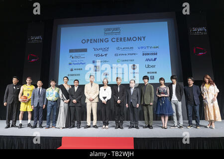 May 29, 2019 - Tokyo, Japan - Attendees pose for the cameras during the opening ceremony for the Short Shorts Film Festival & Asia 2019 (SSFF & Asia) at Hikarie Hall in Shibuya. The SSFF & Asia 2019 is one of Asia's largest international short film festivals held in Tokyo from May 29 to June 16. (Credit Image: © Rodrigo Reyes Marin/ZUMA Wire) Stock Photo