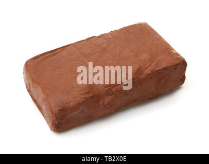 Piece of natural raw red modeling clay isolated on white Stock Photo