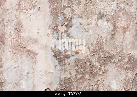 Old beige chipped wall with humidity stains texture background Stock Photo