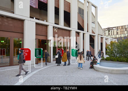 TURIN, ITALY - NOVEMBER 2, 2018: FLAT, art book fair entrance with people at Nuvola Lavazza building in Turin, Italy. Stock Photo
