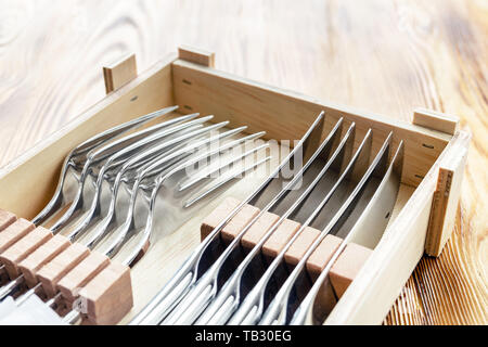 Cutlery steak set for six person in wooden box. New sharp knives and forks. Male gift idea concept Stock Photo
