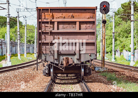 Long freight train approaches to the station. Stock Photo