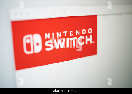 Closeup on Nintendo switch logo photographed from the site screen. Stock Photo