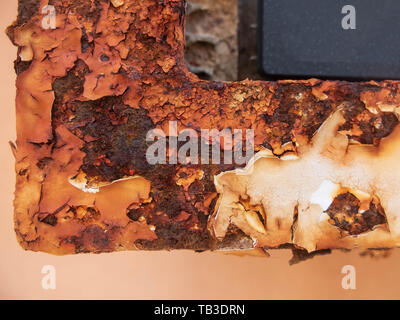 Rusty surface of metallic element with peeling paint. Stock Photo