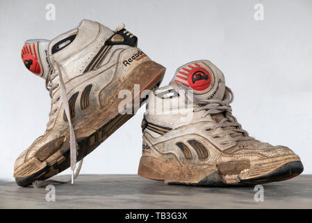 Pair of old worn 1990s Reebok basketball sneakers Stock Photo -