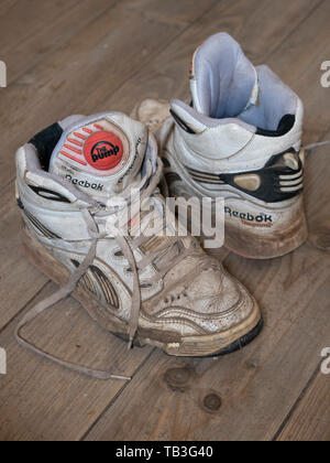 Pair of old worn 1990s Reebok basketball sneakers Stock Photo -