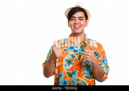 Young happy Asian man smiling and giving thumbs up Stock Photo